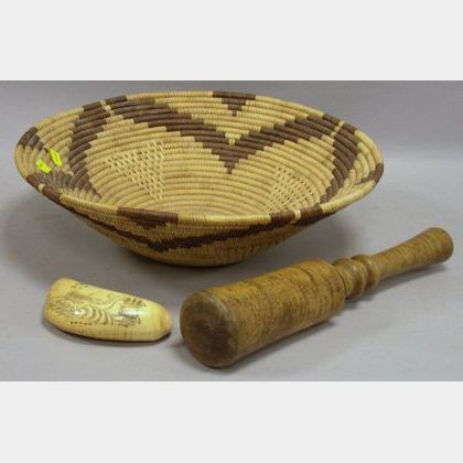 Scrimshaw Decorated Whales Tooth, a Tiger Maple Pestle, and a Native American Coiled Basket. 