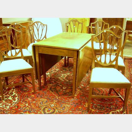Federal-style Inlaid Mahogany Drop-leaf Dining Table and a Set of Six Potthast Federal-style Inlaid Mahogany Dining Chairs