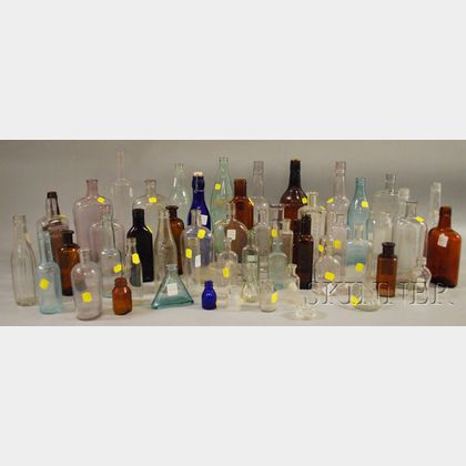 Approximately Fifty-five Assorted Mostly Colorless and Brown Amber Molded Glass Bottles