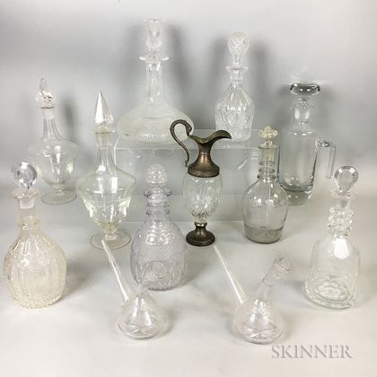 Twelve Colorless Cut and Mold-blown Glass Decanters and Jugs