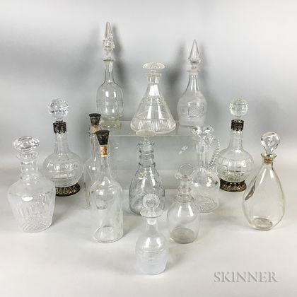 Thirteen Colorless Cut Glass Decanters and Bottles
