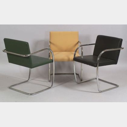 Three Mies van der Rohe BRNO Leather and Cloth Upholstered Bent Tubular Steel Armchairs.