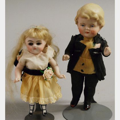 Two All-Bisque Boy and Girl Dolls