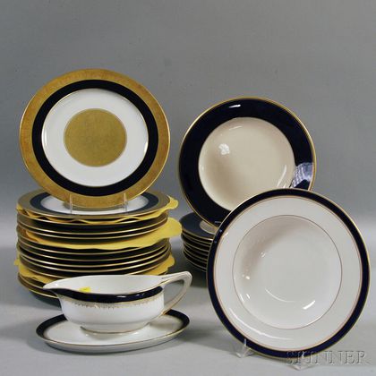 Twenty-four Blue, White, and Gold Dinner Plates