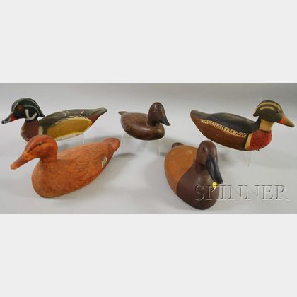 Four Painted Carved Wooden Duck Decoys and a Victor Painted Composition Duck Decoy. 