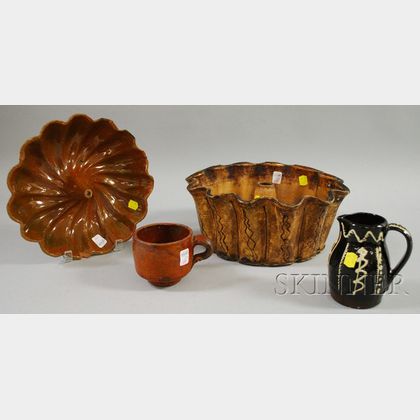 Glazed Redware Cup, Two Culinary Molds, and Slip-decorated Jug. 
