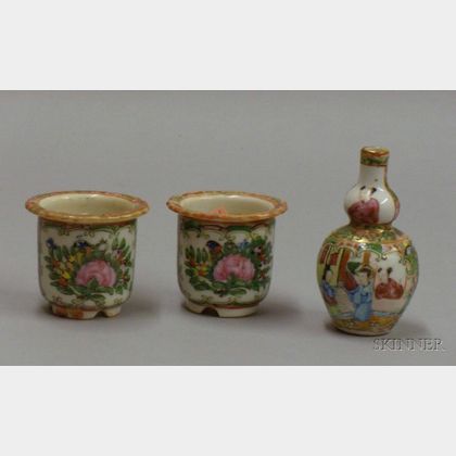Two Miniature Chinese Export Porcelain Rose Medallion Cache Pots and a Gourd-shaped Vase. Estimate $140-200