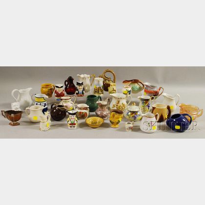 Collection of Mostly Ceramic Creamers, Twelve Pieces of Milk Glass Tableware, and Eight Pottery Table Items