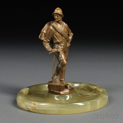 Onyx Vide Poche with a Bronze Figure of a Mountain Climber