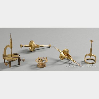 Four Brass Upright Tools and a Movement Holder