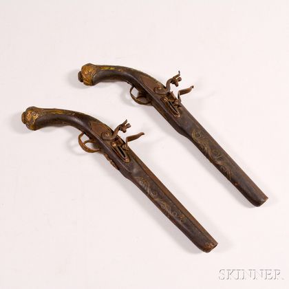 Pair of Reproduction Brass-inlaid Flintcock Pistols. Estimate $200-300