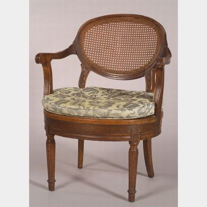 Continental Neoclassical Carved Oak and Caned Open Armchair