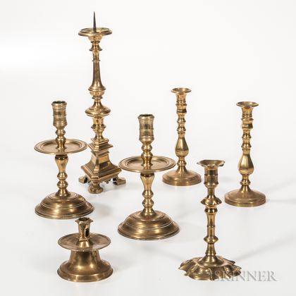 Seven Early Brass Candlesticks
