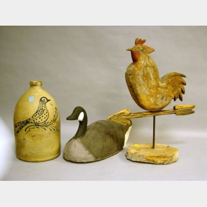 Edmands & Co. Cobalt Bird Decorated Two-Gallon Stoneware Jug, a Painted Canvas Canada Goose Decoy, and a Carved and Painted Wooden Roos