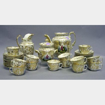 Thirty-four Piece Paris Porcelain Painted and Gilded Partial Tea Service. 