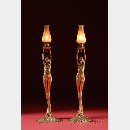 Pair of American Art Nouveau Cast-metal and Quezal Glass Figural Candlesticks