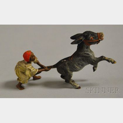 Austrian Miniature Cold-painted Bronze Figure of an Arab Boy Pulling the Tail of a Rearing Donkey
