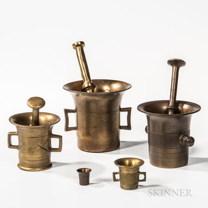 Three Brass Mortar and Pestles and a Small Mortar