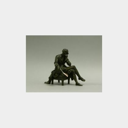 Bronze Figure of a Seated Gentleman. 