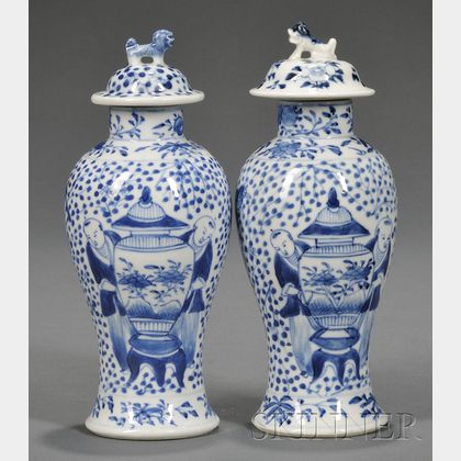 Pair of Blue and White Covered Vases