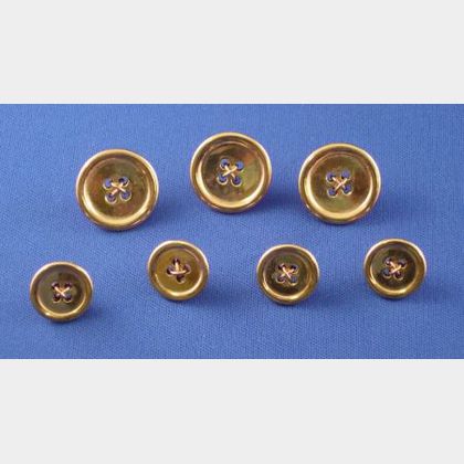 Three Large and Four Small 14kt Gold Blazer Buttons. 