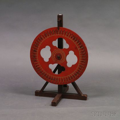 Red-painted Wheel of Chance and Stand