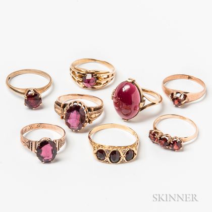 Eight Gold and Garnet Rings