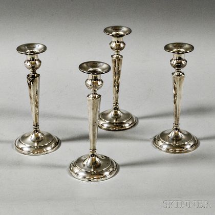 Four Weighted Sterling Silver Candlesticks