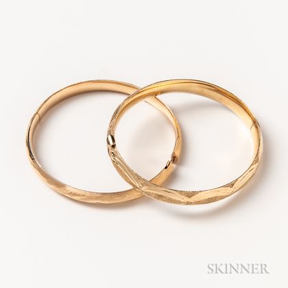 Two 14kt Gold Engraved Hinged Bangles