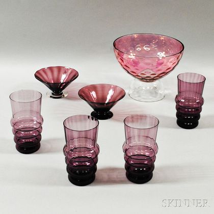Small Steuben Amethyst Glass Compote, Two Other Compotes, and a Set of Four Goblets. Estimate $175-225