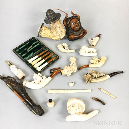 Seventeen Carved Meerschaum and Wood Pipes and Cheroot Holders. Estimate $300-500