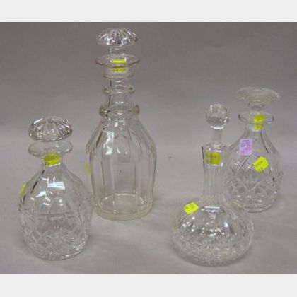 Four Small Colorless Cut Leaded Glass Decanters. 