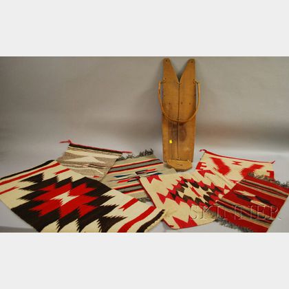 Southwest Cradleboard, Four Small Navajo Textiles and Two Chimayo Weavings. 