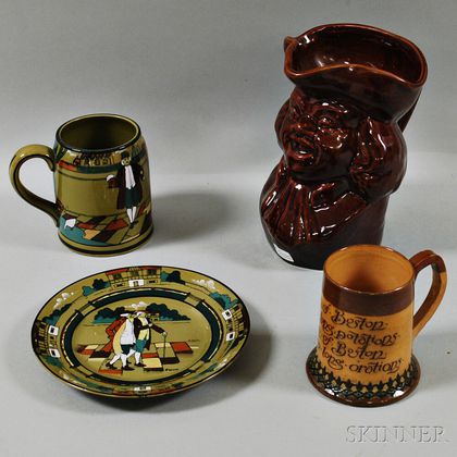 Buffalo Pottery Deldare Ware Mug and Plate, a Doulton Lambeth Mug, and a Rockingham-glazed Toby Jug