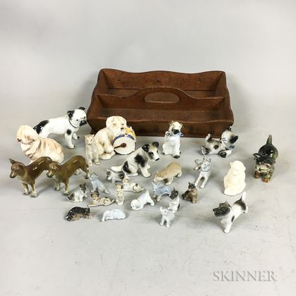 Approximately Twenty-seven Ceramic Dogs and a Knife Box. Estimate $100-150