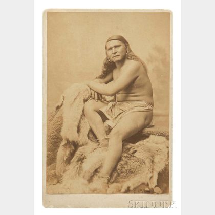 Framed Cabinet Card of an Indian Sitting on Animal Skins