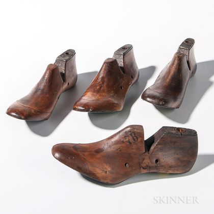 Four Carved Wood and Iron Shoe Forms
