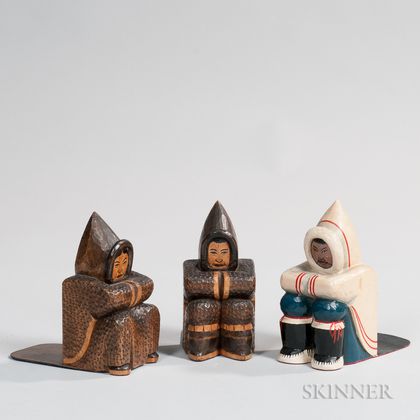 Pair of Carved Eskimo Bookends and a Single Carved and Painted Eskimo Bookend
