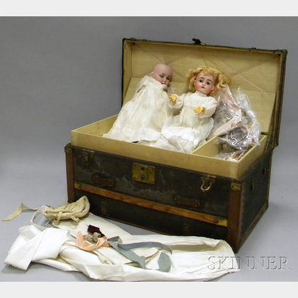 Two German Bisque Head Dolls and a Doll's Trunk with Clothing