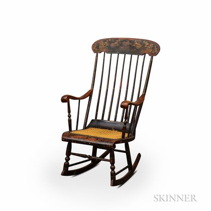 Black-painted and Stenciled Caned Rocking Armchair. Estimate $20-200