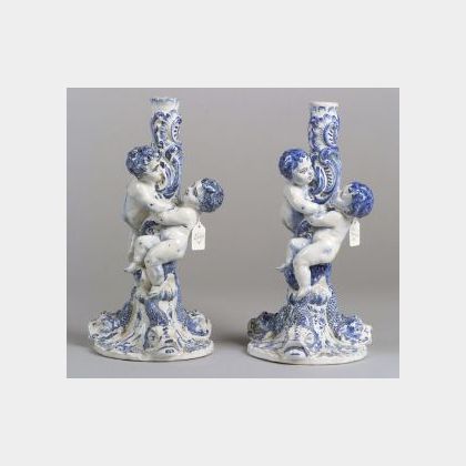 Pair of Tin Glazed Earthenware Figural Candlesticks