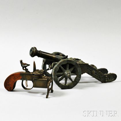 Miniature Patinated Bronze Cannon and a Dunhill Tinder Pistol. Estimate $200-400