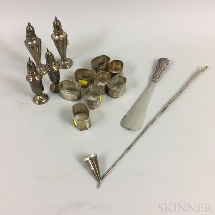 Tiffany & Co. Sterling Silver Snuffer, Two Pairs of Sterling Silver Weighted Salt Shakers, a Shoehorn, and Eight Silver-plated Napkin R