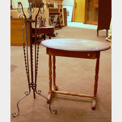 Wrought Iron Plant Stand and a Late Victorian Cottage Oval-top Pine and Maple Occasional Table with Drawer. 