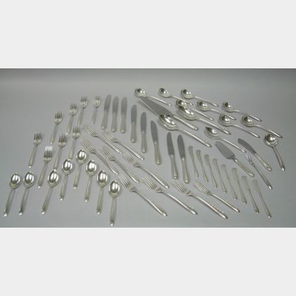 Fifty-seven Piece Towle Sterling Silver Flutes Pattern Flatware Set. 