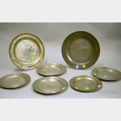 Five Pewter Plates and Two Chargers