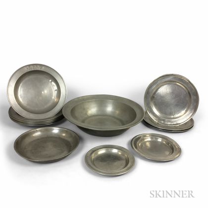Twelve Continental Pewter Dishes and a Wash Basin