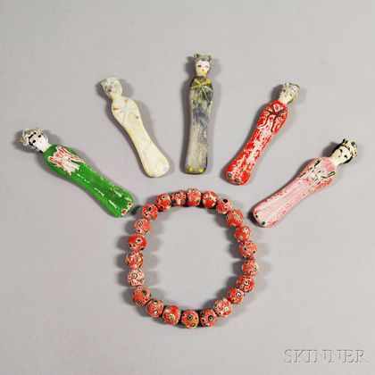 Five Ceramic Dolls and a Strand of Ceramic Beads. Estimate $150-250
