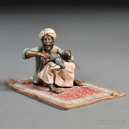 Cold-painted Bronze Figure of an Arab on a Carpet