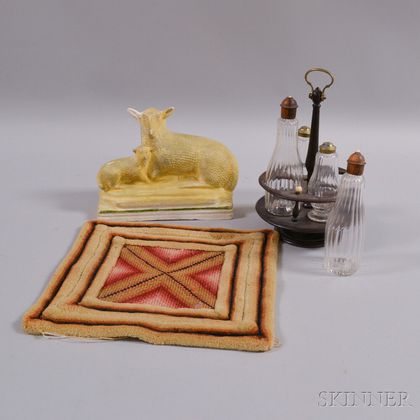 Chalkware Figure of a Sheep and Lamb, a Cruet Set, and a Needlepoint Mat. Estimate $20-200